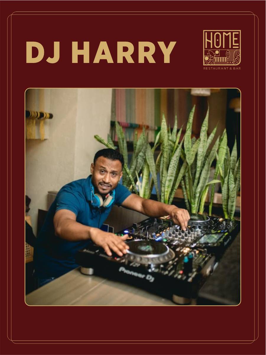 DJ Harry mixing live music in an elegant nightlife setting